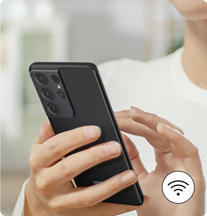 A person is managing refrigerator remotely via smartphone and wi-fi.